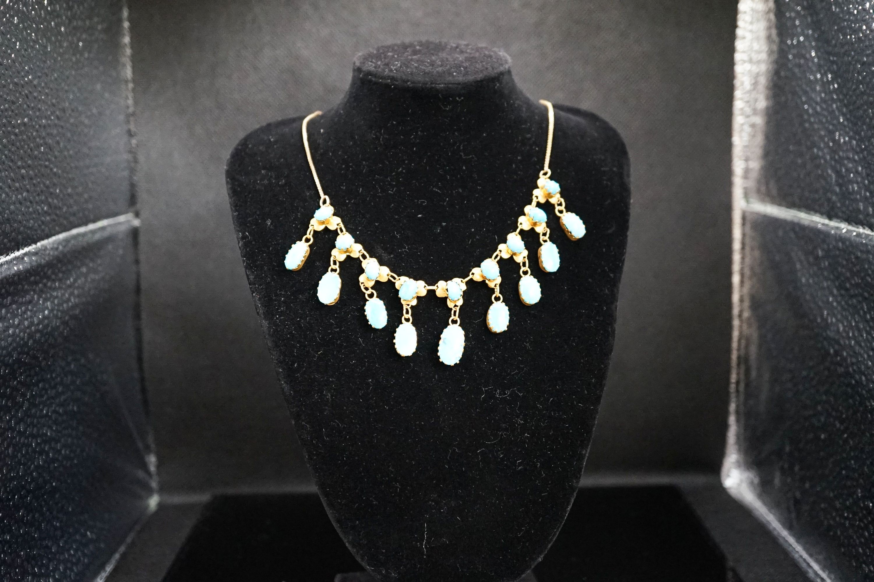 A 9k yellow metal and turquoise set drop fringe necklace, 43cm, gross 11.9 grams.